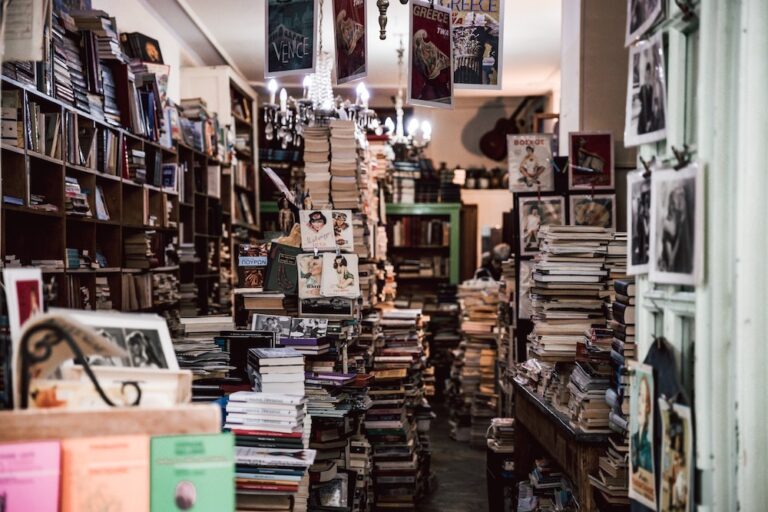 A bookstore with cluttered stacks of books